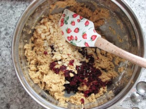 Stir in cranberries and macadamias