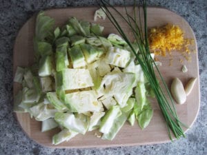 Cabbage, garlic, lemon zest, chives