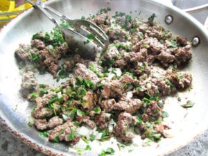 Browned, drained lamb with sage, parsley and onion