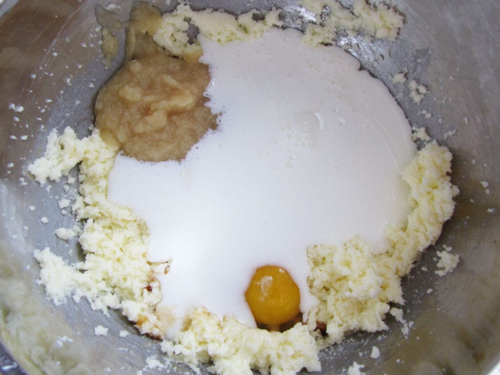 Cream butter and sugar, add egg, apple sauce, vanilla and buttermilk