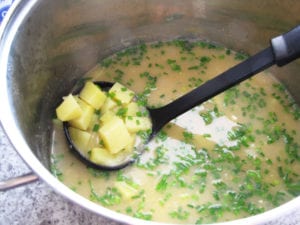 Add chives to the soup and serve