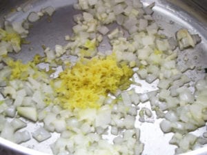 Saute onions and garlic in butter, add lemon zest and white wine vinegar