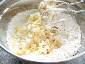 Add Dried Pineapple, Macadamia Nuts, White Chocolate Chips and Coconut