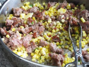 Add Fresh Corn, Garlic and Peppers to the Skillet