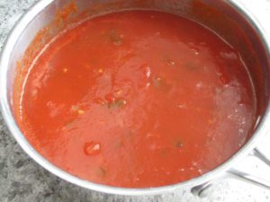 Add tomato puree, stewed tomatoes and broth
