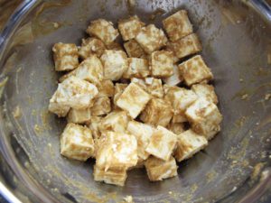 Coat tofu cubes in miso mixture
