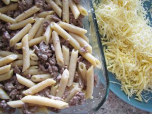 Layer two beef and noodles and remaining cheese