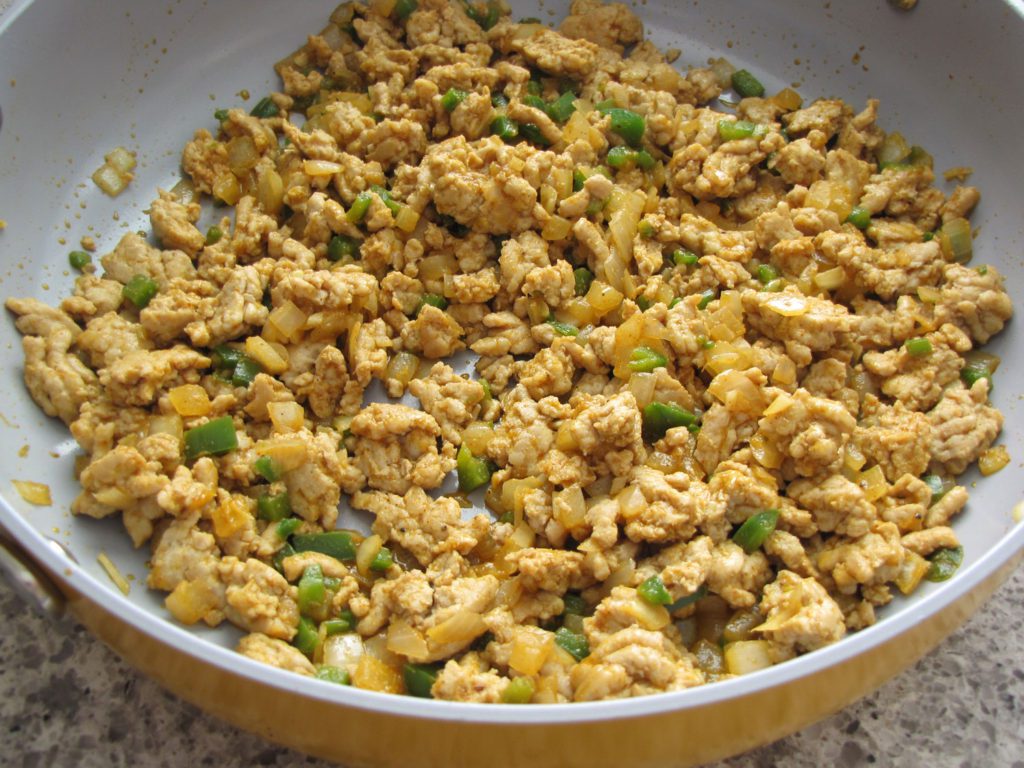 ground chicken cooked with onion, garlic, jalapeno, spices and deglazed with cider vinegar