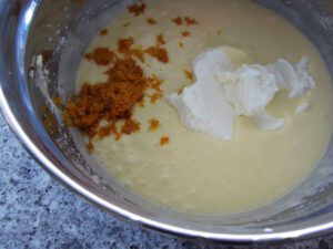 add yogurt in parts, alternating with flour mixture